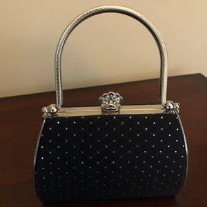 Black top handle evening bag